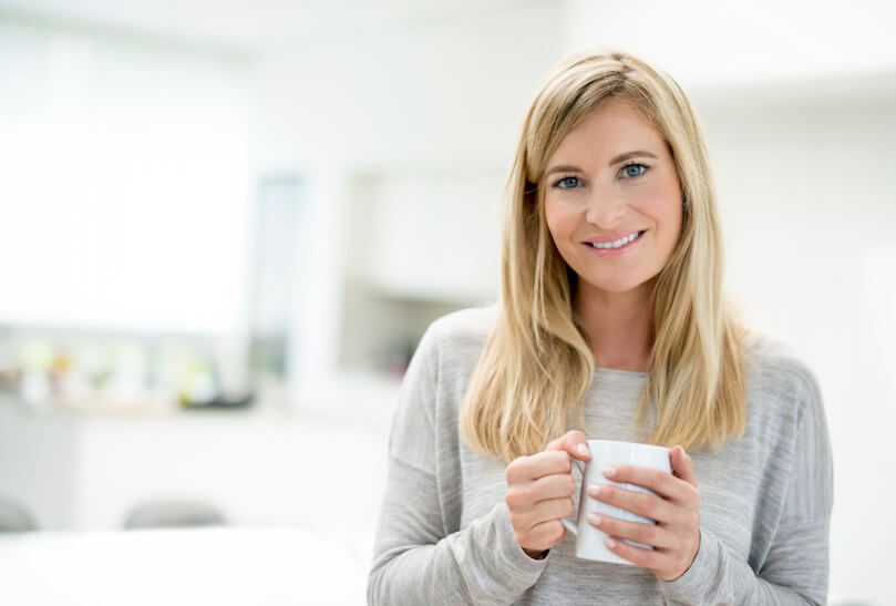 Woman holding warm drink
