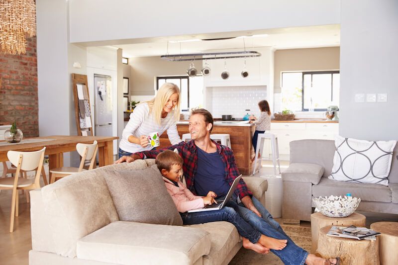 Family at home sitting on couch