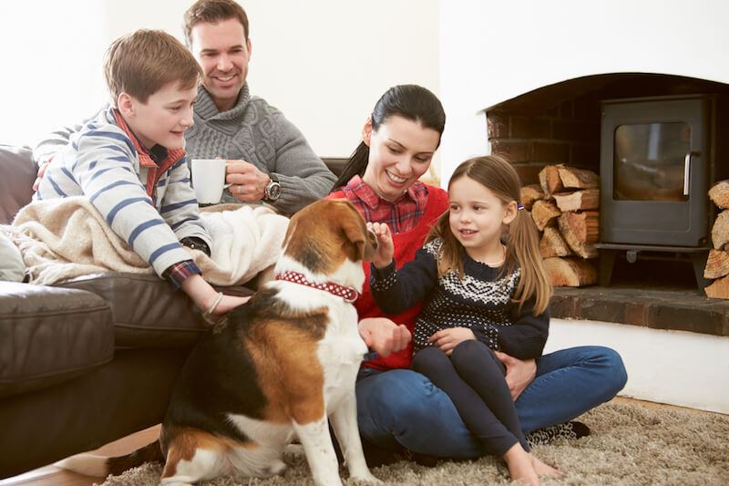 Family with pet staying warm