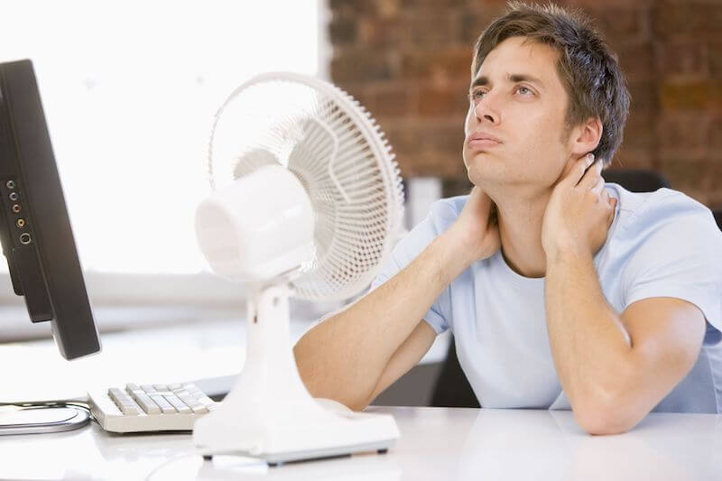 Man Cooling off at Home