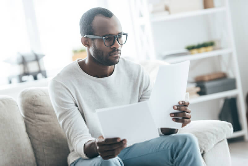 Man looking at AC repair documents