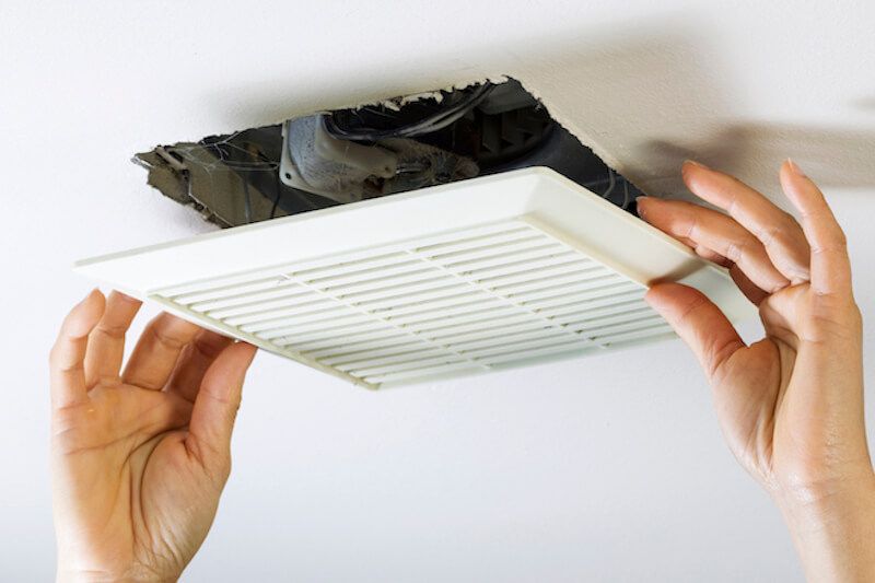 professional checking bathroom ventilation fan