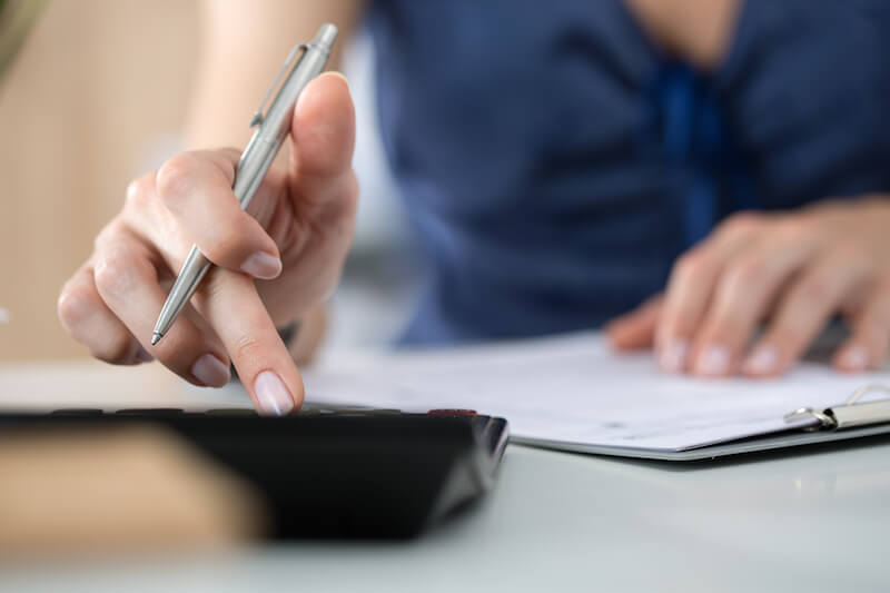 Woman calculating bills